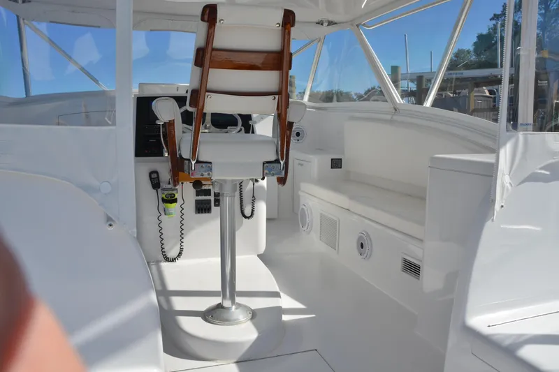 Slide: The Image of 2006 Custom Carolina Heritage Express boat interior with captain's chair and navigation equipment. - 5