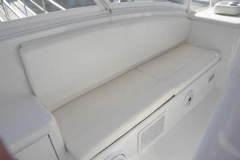 Slide: The Image of White cushioned seating on 2006 Custom Carolina Heritage Express boat. - 9