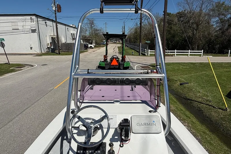 Slide: The Image of 2022 Majek 18 M2 boat with Garmin equipment on a street, viewed from the helm. - 11