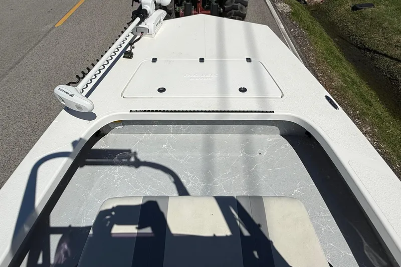 Slide: The Image of 2022 Majek 18 M2 boat deck with trolling motor on a road. - 13