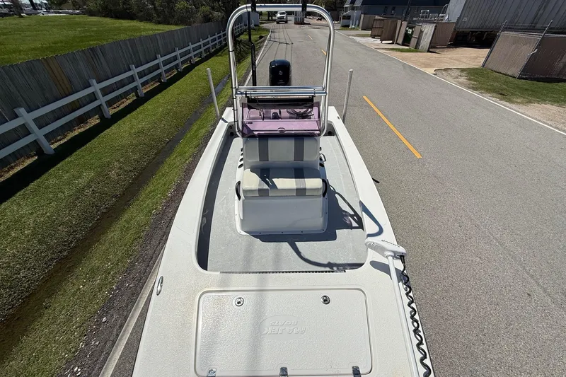 Slide: The Image of 2022 Majek 18 M2 boat on road, top view, showcasing deck and seating. - 15