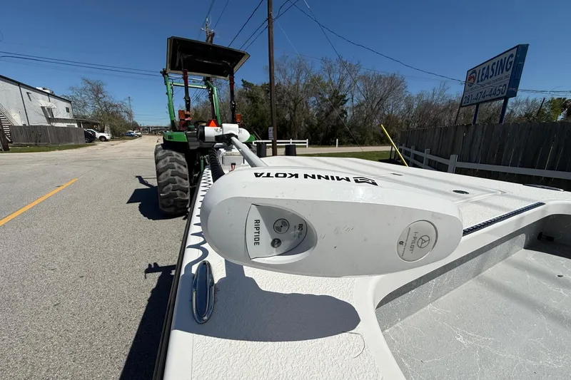 Slide: The Image of 2022 Majek 18 M2 boat with Minn Kota Riptide motor on a sunny street. - 17
