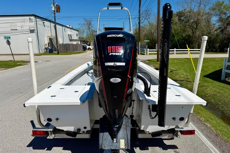 Slide: The Image of 2022 Majek 18 M2 boat with Mercury 115 Pro outboard motor on a trailer. - 3