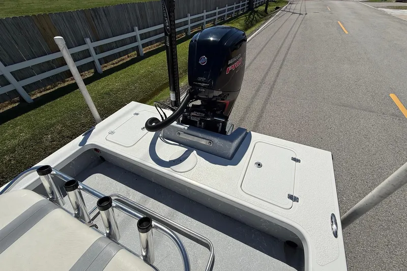 Slide: The Image of 2022 Majek 18 M2 boat with Mercury Pro XS engine on a road. - 7