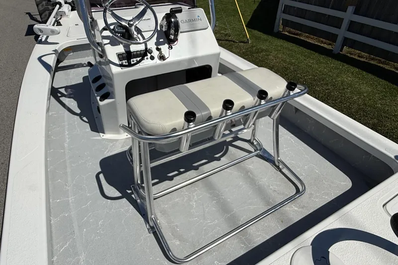 Slide: The Image of 2022 Majek 18 M2 boat interior with steering console and seating. - 8