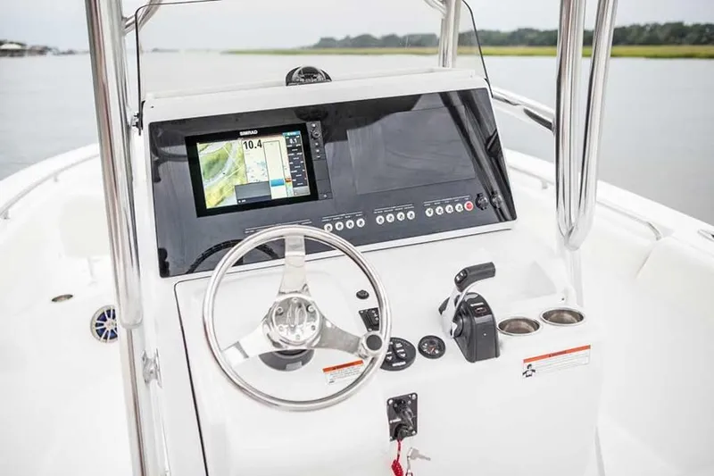 Slide: The Image of Manufacturer Provided Image: 2017 Sportsman Heritage 251 Center Console boat dashboard with navigation system. - 12