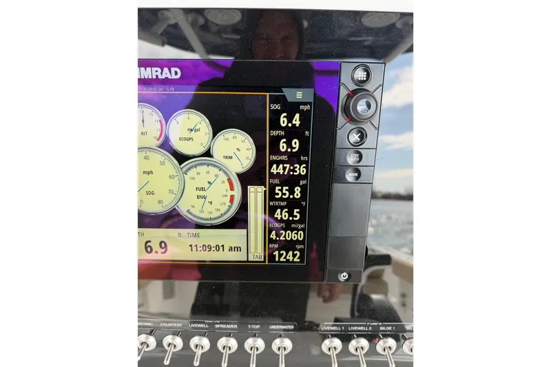 Slide: The Image of Simrad display on 2017 Sportsman Heritage 251 Center Console showing navigation data. - 24