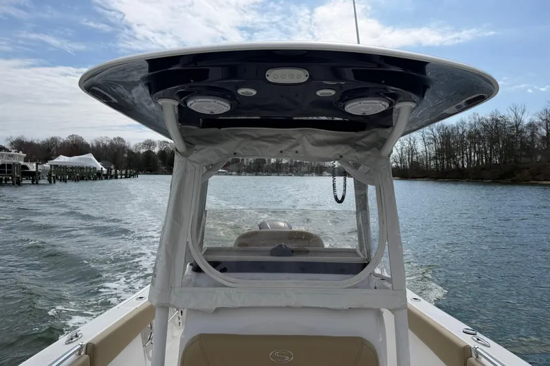 Slide: The Image of 2017 Sportsman Heritage 251 Center Console boat cruising on a scenic waterway. - 26