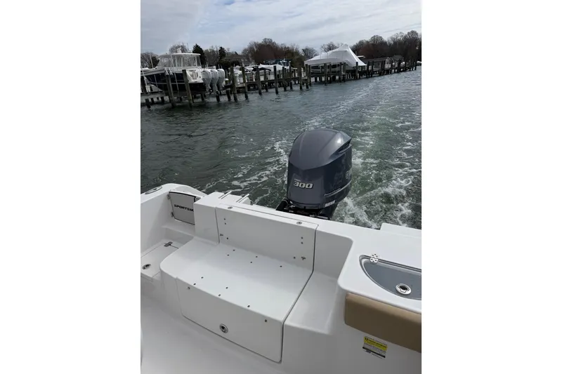 Slide: The Image of 2017 Sportsman Heritage 251 Center Console boat with powerful 300 HP engine on water. - 29
