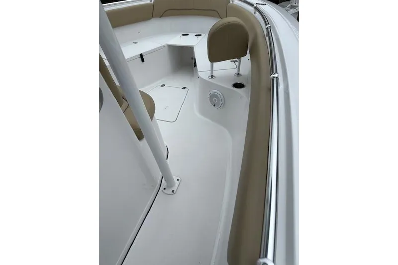 Slide: The Image of 2017 Sportsman Heritage 251 Center Console boat interior with beige seating and white deck. - 3