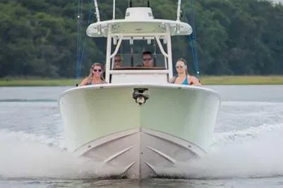 Slide: The Image of Manufacturer Provided Image: 2017 Sportsman Heritage 251 Center Console boat cruising on water. - 9
