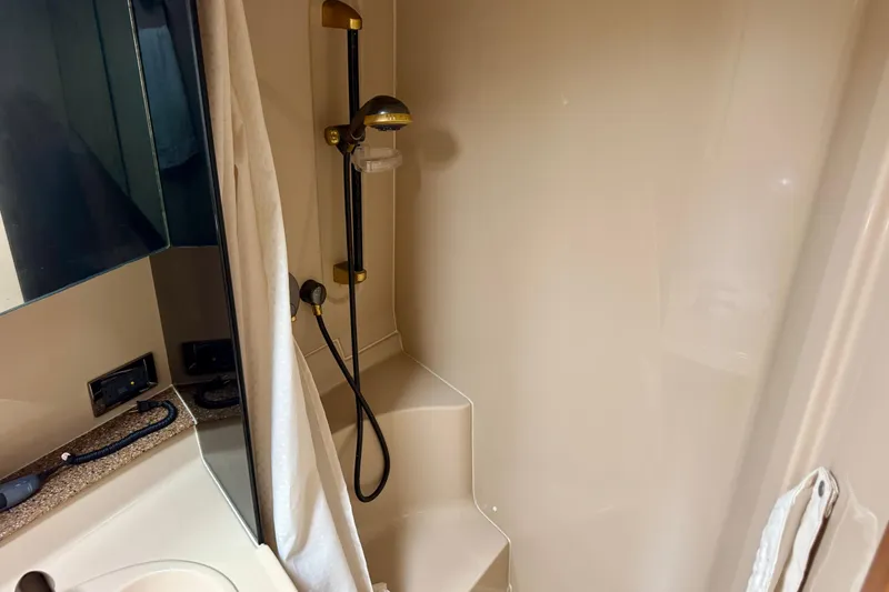 Slide: The Image of Bathroom interior of 2001 Cruisers Yachts 3470 Express with shower and sink. - 10