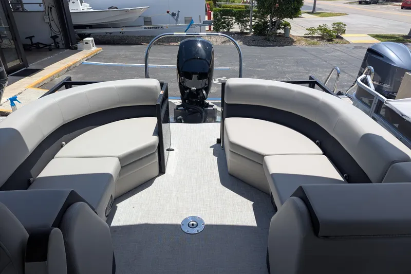 Slide: The Image of Modern Dockside 22DQ2.75 pontoon boat interior with plush seating, 2026 model. - 10