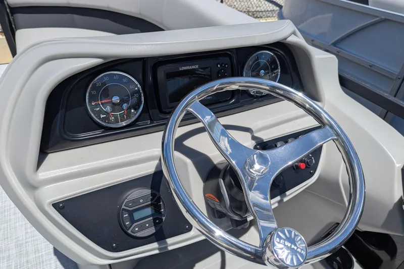 Slide: The Image of Captain's chair and steering wheel on 2026 Dockside 22DQ2.75 pontoon boat deck. - 4