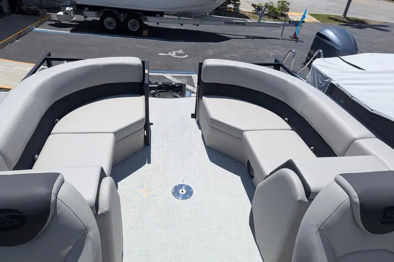 Slide: The Image of Luxurious 2026 Dockside 22DQ2.75 pontoon boat interior with plush seating and modern helm. - 6