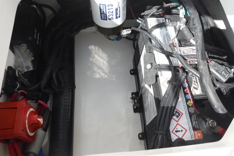 Slide: The Image of Battery compartment of 2015 Boston Whaler 210 Montauk with wiring and fuel filter. - 24