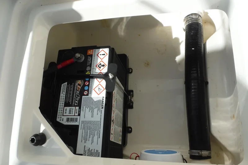 Slide: The Image of Battery compartment of a 2015 Boston Whaler 210 Montauk boat. - 25