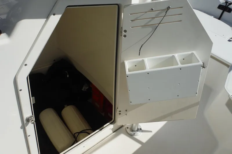 Slide: The Image of Open storage compartment on a 2015 Boston Whaler 210 Montauk boat. - 29