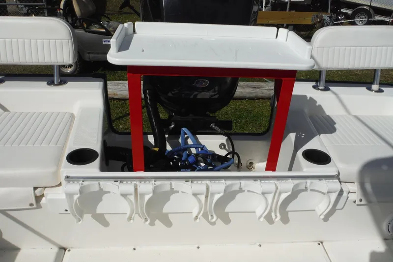 Slide: The Image of Boston Whaler 210 Montauk 2015 boat interior with seating and fishing rod holders. - 33