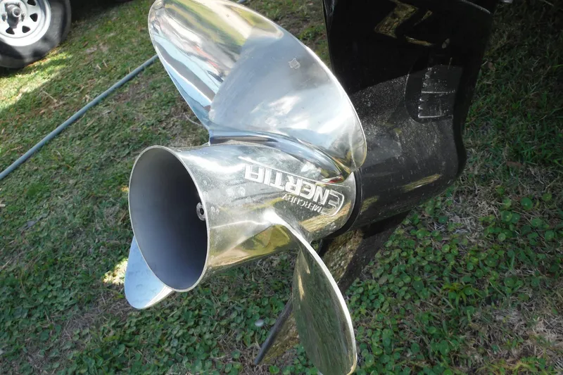 Slide: The Image of Shiny boat propeller of a 2015 Boston Whaler 210 Montauk on grassy ground. - 45