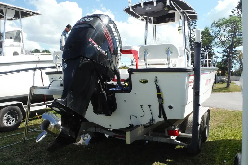 Slide: The Image of 2015 Boston Whaler 210 Montauk boat with Mercury outboard motor on trailer. - 6