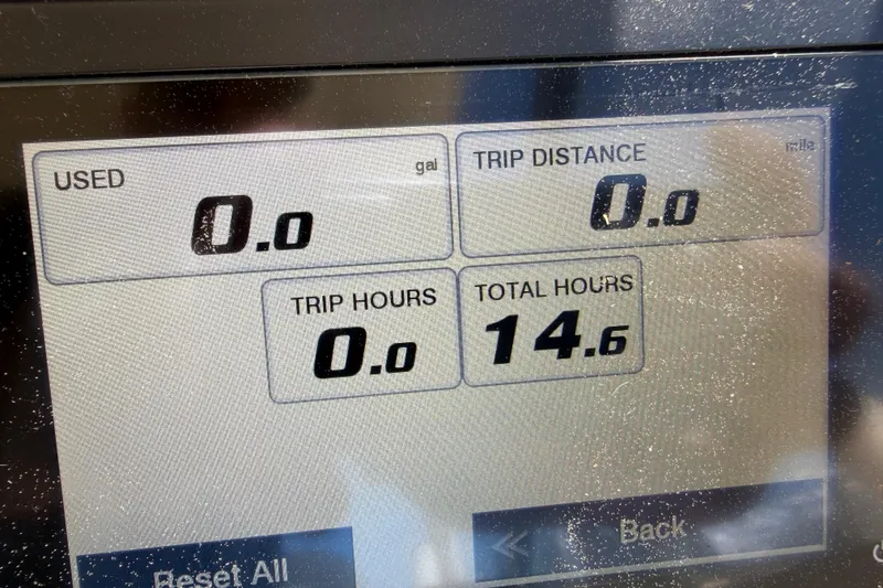 Slide: The Image of Dashboard display of 2023 Grady-White Adventure 218 showing trip metrics and total hours. - 18