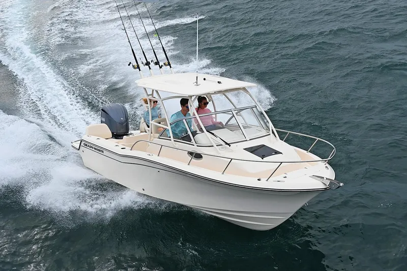 Slide: The Image of Manufacturer Provided Image: 2023 Grady-White Adventure 218 boat cruising on the water. - 2