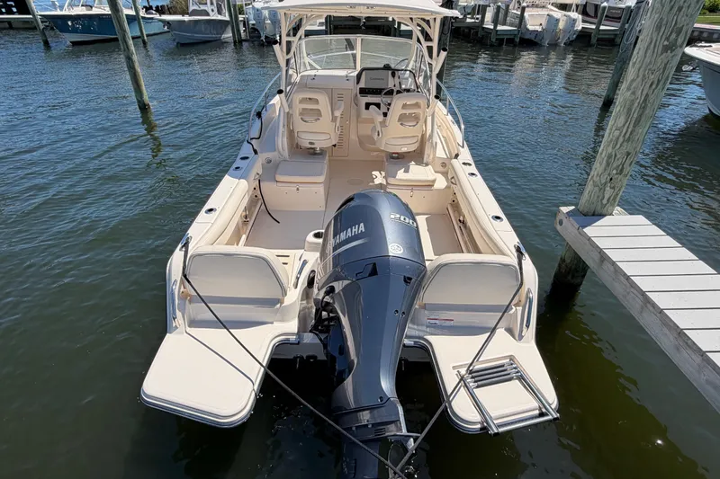 Slide: The Image of 2023 Grady-White Adventure 218 boat with Yamaha engine docked at marina. - 20