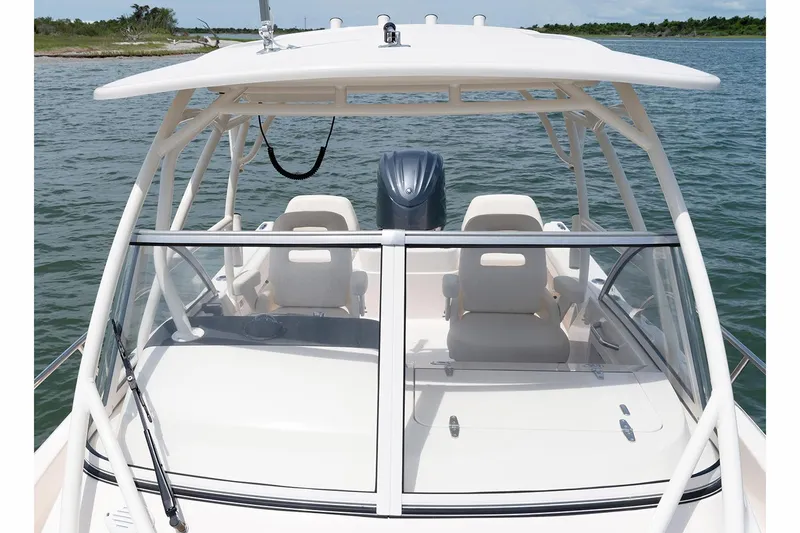 Slide: The Image of Manufacturer Provided Image: 2023 Grady-White Adventure 218 boat on water, front view. - 6