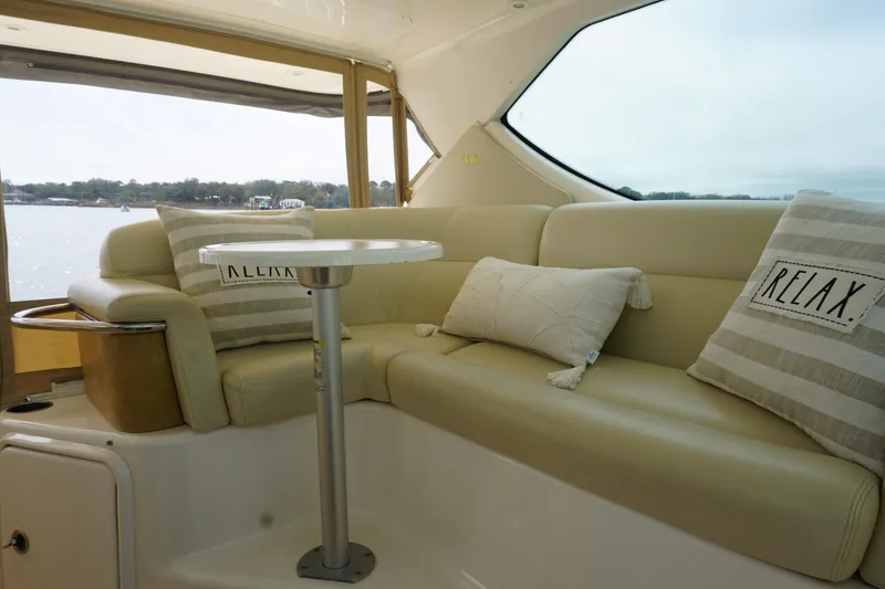 Slide: The Image of Interior of 2007 Tiara Yachts 3900 Sovran with cozy seating and decorative pillows. - 12