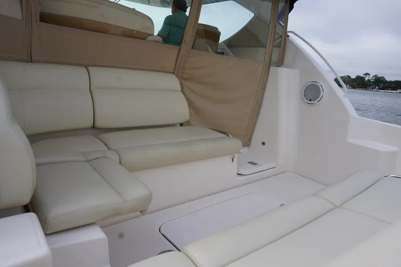 Slide: The Image of 2007 Tiara Yachts 3900 Sovran interior with beige seating and water view. - 14