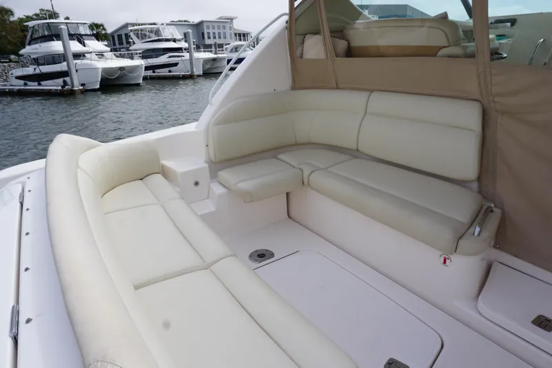 Slide: The Image of 2007 Tiara Yachts 3900 Sovran with spacious, luxurious seating in a marina setting. - 15