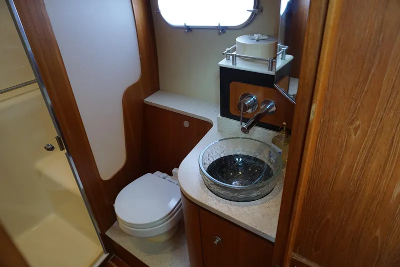 Slide: The Image of Luxurious 2007 Tiara Yachts 3900 Sovran bathroom with glass sink and modern fixtures. - 8