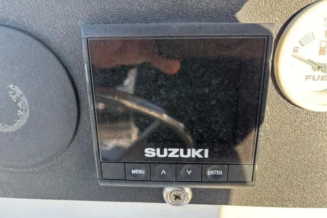 Slide: The Image of Suzuki display on 1984 Mako 221 Center Console boat dashboard. - 19