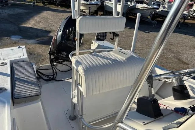 Slide: The Image of 1984 Mako 221 Center Console boat interior with seating and controls. - 28