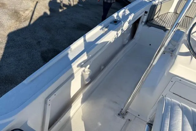 Slide: The Image of 1984 Mako 221 Center Console boat interior with seating and steering wheel. - 25