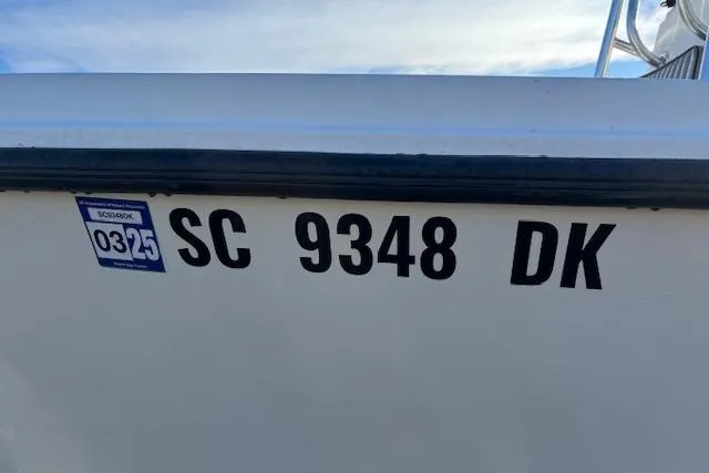 Slide: The Image of 1984 Mako 221 Center Console boat with registration number SC 9348 DK. - 6