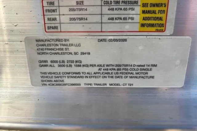 Slide: The Image of Label on a Charleston Trailer LLC, detailing tire specifications and compliance information. - 7