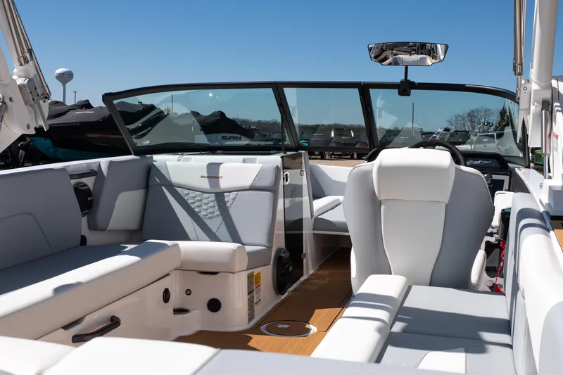 Slide: The Image of 2026 MasterCraft NXT24 boat interior with sleek white seating and modern design. - 10