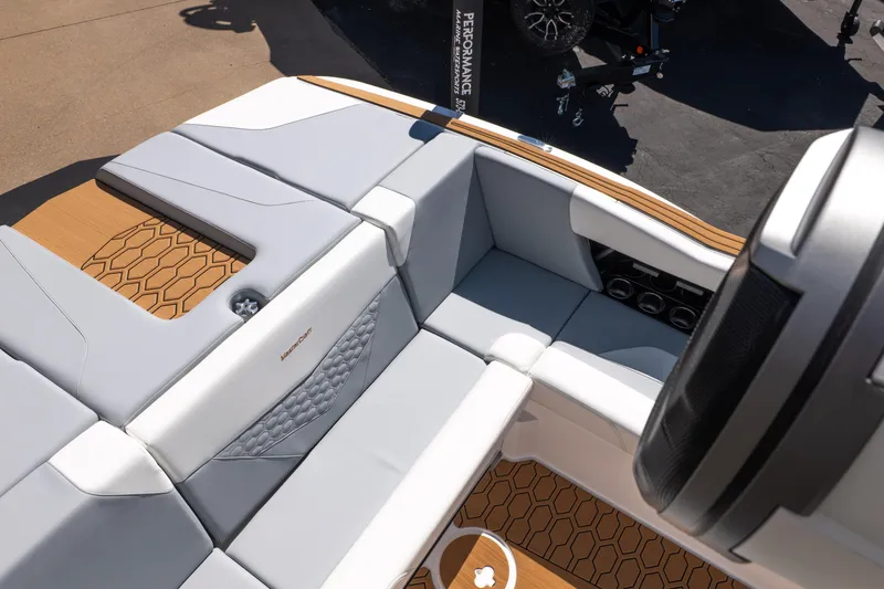 Slide: The Image of 2026 MasterCraft NXT24 boat interior with sleek seating and modern design elements. - 11