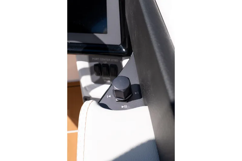 Slide: The Image of Control panel of 2026 MasterCraft NXT24 boat with audio adjustment knob. - 18