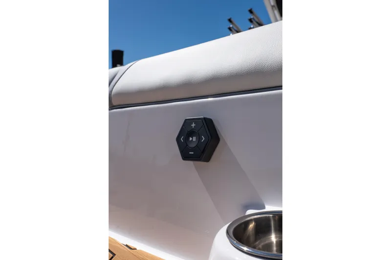 Slide: The Image of Control panel on 2026 MasterCraft NXT24 boat, featuring sleek design and cup holder. - 21