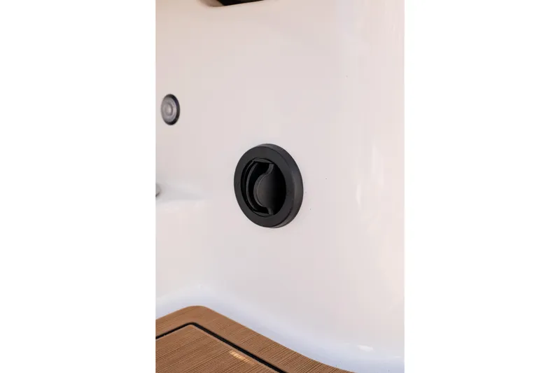 Slide: The Image of 2026 MasterCraft NXT24 boat detail, featuring a sleek black handle on a white surface. - 28