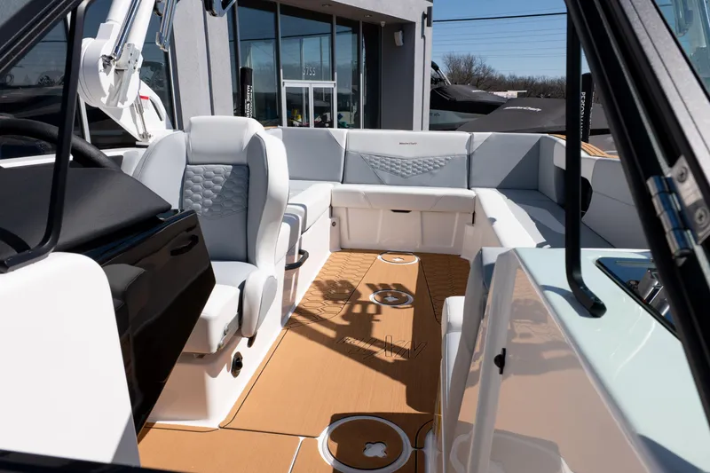 Slide: The Image of 2026 MasterCraft NXT24 boat interior with modern seating and sleek design. - 32