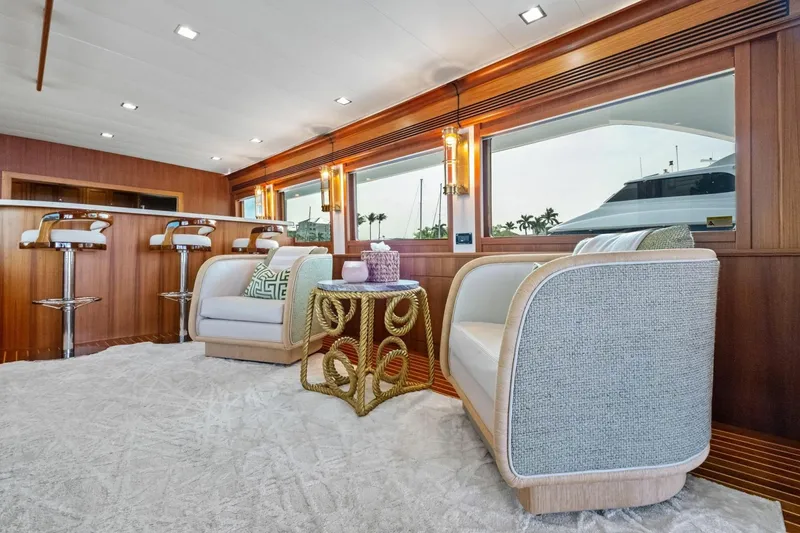 Slide: The Image of Luxurious interior of 2024 Marlow 90 V yacht with elegant seating and bar area. - 10