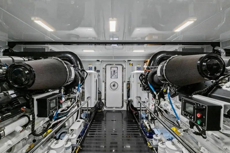Slide: The Image of Engine room of 2024 Marlow 90 V yacht, showcasing advanced machinery and equipment. - 102