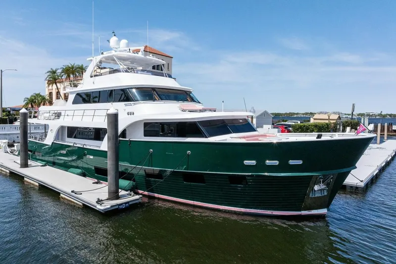 Slide: The Image of Luxurious 2024 Marlow 90 V yacht docked at marina under clear blue sky. - 104