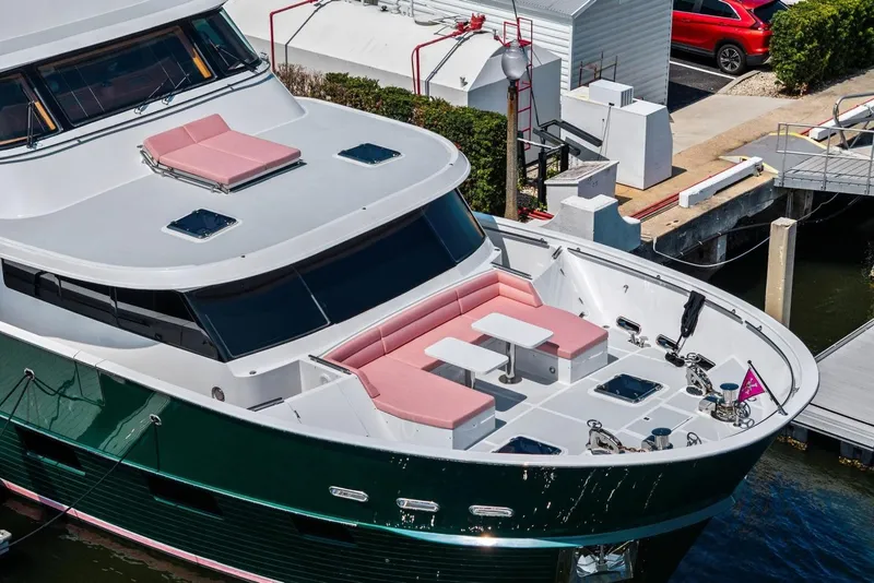 Slide: The Image of Luxurious 2024 Marlow 90 V yacht with spacious deck and elegant seating area. - 105