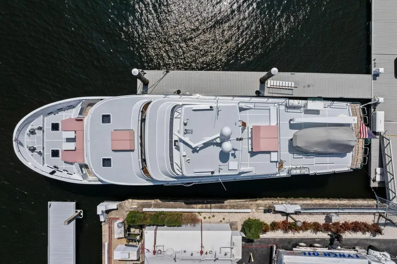 Slide: The Image of Aerial view of 2024 Marlow 90 V yacht docked at a marina. - 106