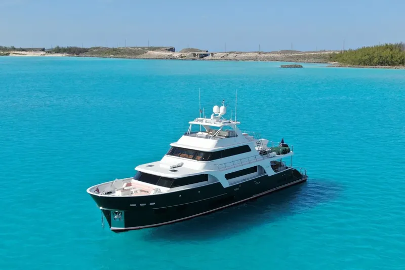 Slide: The Image of Luxurious 2024 Marlow 90 V yacht cruising in clear turquoise waters. - 110